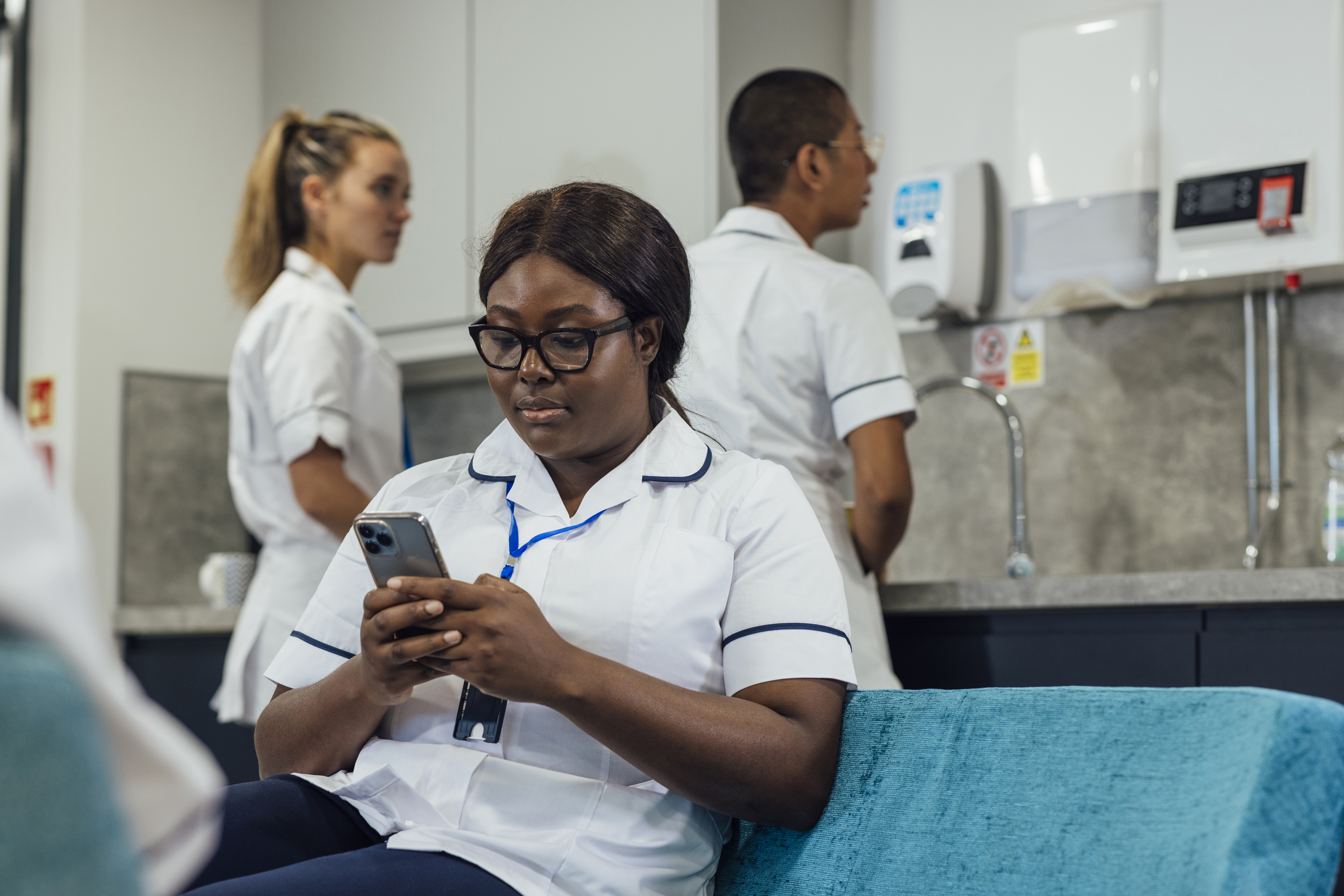 Healthcare professional using her phone